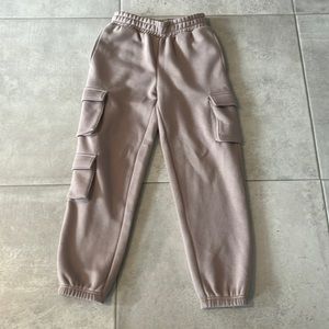 This is a pair of tan sweatpants from forever 21 size s